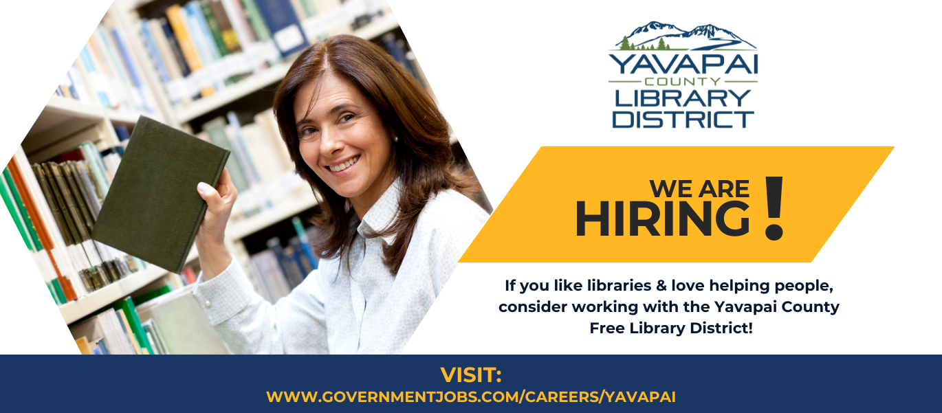 picture of woman holding book placing it on library shelf